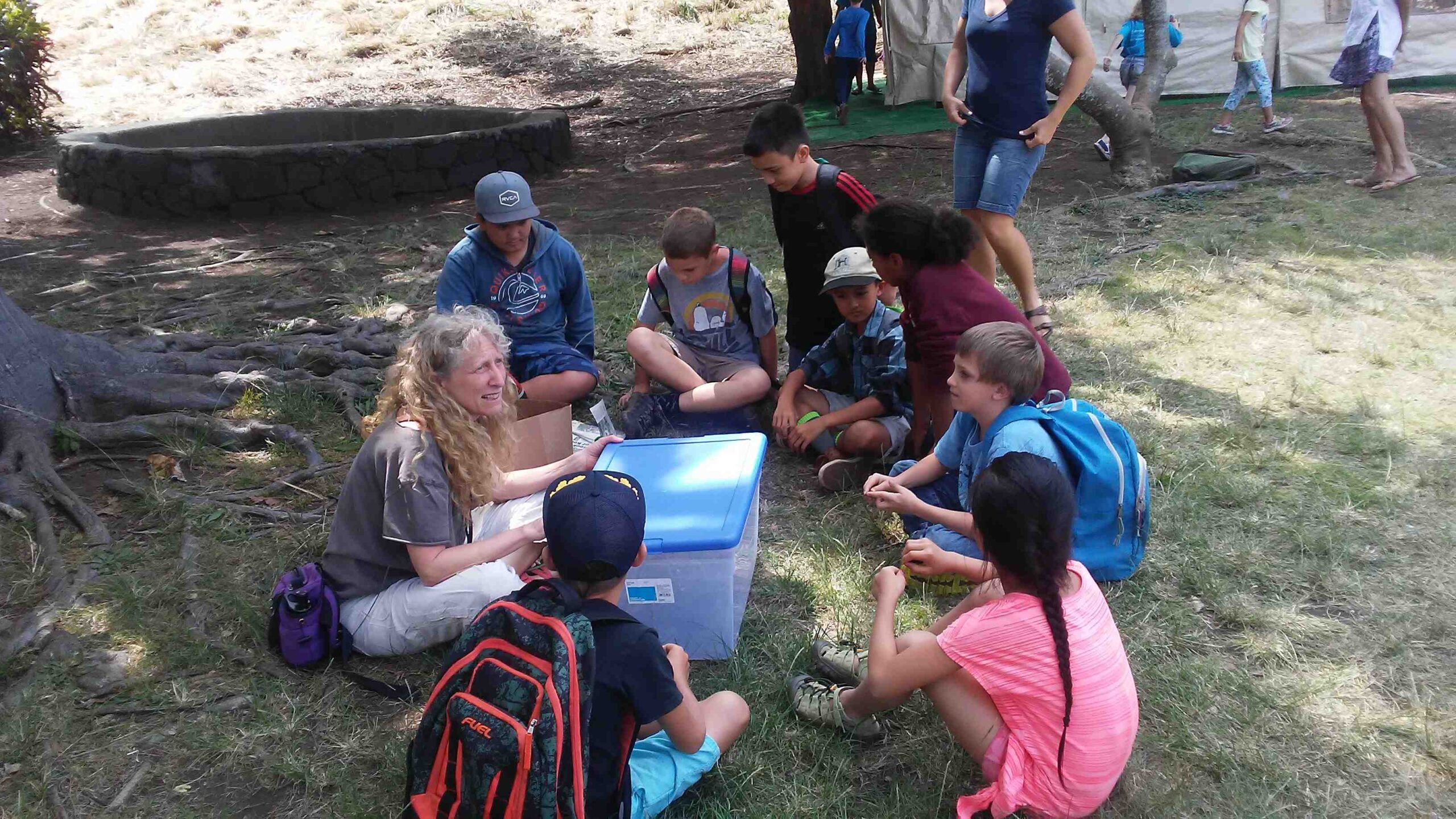 Barbara and Ka'u students making worm cake.
